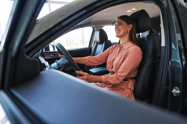 Excited young lady looking ready for the test drive — Stock Photo, Image