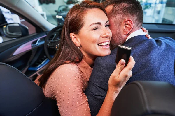 Happy lady becoming car owner and smiling — Stock Photo, Image