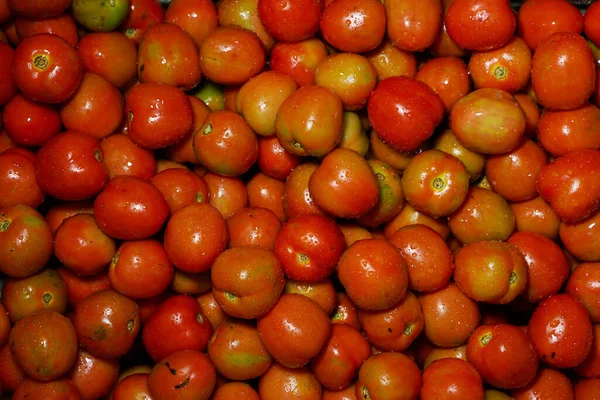 Delicious red tomatoes it can be used as background. (selective focus). Tomato vegetable concept space for banner top view. Tomatoes for background. Healthy eyes with regular consumption of tomatoes.