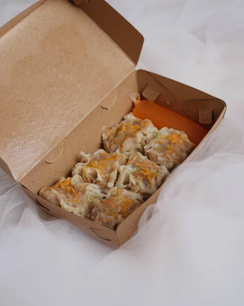 Original dimsum dumplings in a packaging box. Siomay is thought to have come from Inner Mongolia. In Chinese siomay(shaoma). Indonesian dumplings generally use mackerel as the main ingredient.