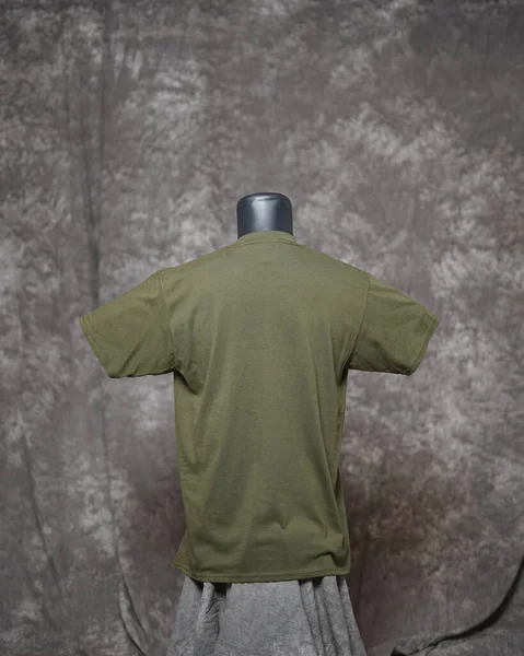 Army men\'s blank t shirt template, back side, natural shape on invisible mannequin, for your design mockup for printing, isolated on motif gray background. Free space for your ad.