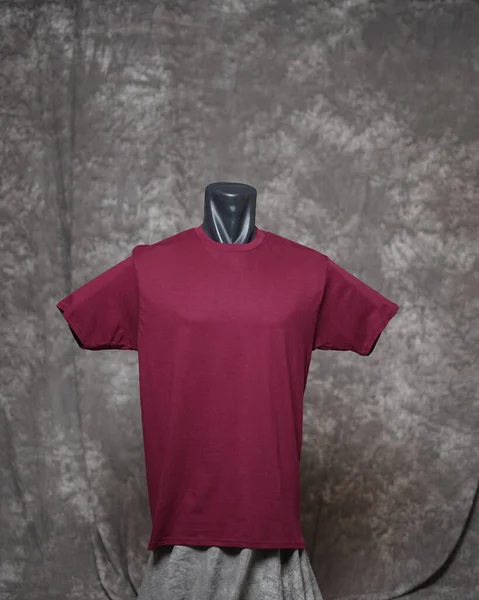 Maroon man blank t-shirt template, front view, natural shape on invisible mannequin, for your design mockup for printing, isolated on gray motif background. Free space for your ad.