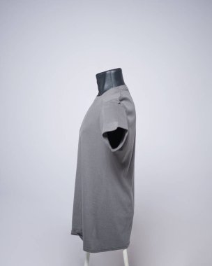Gray color blank men's t-shirt template, side view, natural shape on invisible black mannequin, for your mockup design to print, isolated on plain white background. Free space for your ad.