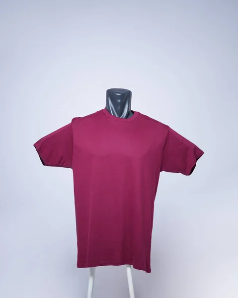 Maroon color men\'s blank t-shirt template, front view, natural shape on invisible mannequin, for your mockup design to print, isolated on a plain white background. Free space for your ad.