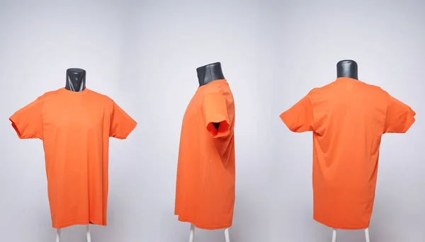 Orange blank men's t-shirt template, view from three directions, natural shape on a black mannequin, for your mockup design to print, isolated on a plain white background. Free space for your ad.