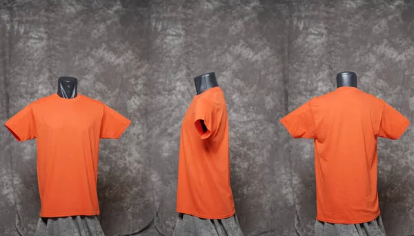 Orange blank men\'s t-shirt template, view from three directions, natural shape on black mannequin, for your mockup design to print, isolated on motif gray background. Free space for your ad.Focus blur