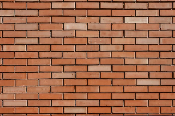 Brick wall background. The texture of a decorative brick is brown. Close-up
