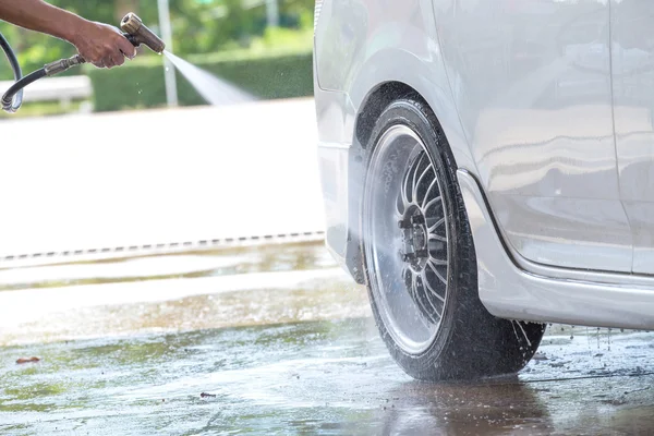 Car wash with flowing water — Stock Photo, Image