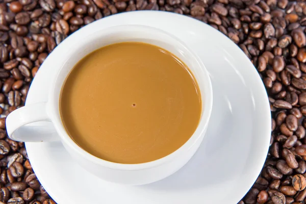 Cup of coffee with beans — Stock Photo, Image
