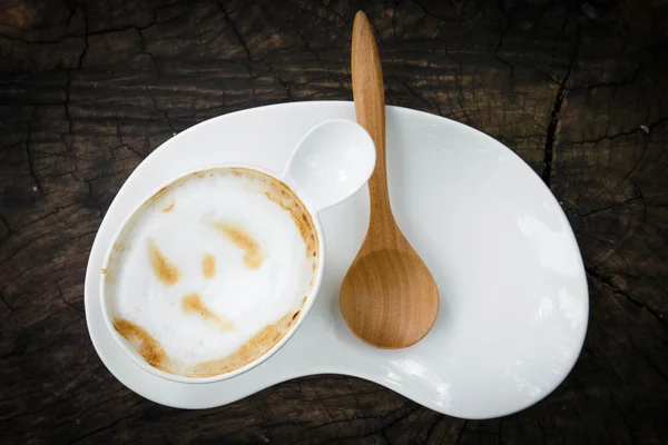 Cup of coffee with wood spoon — Stock Photo, Image