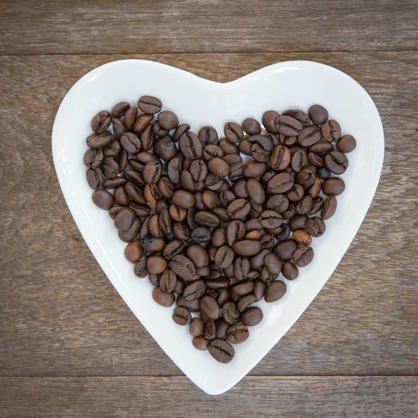 Coffee beans on wooden background — Stock Photo, Image