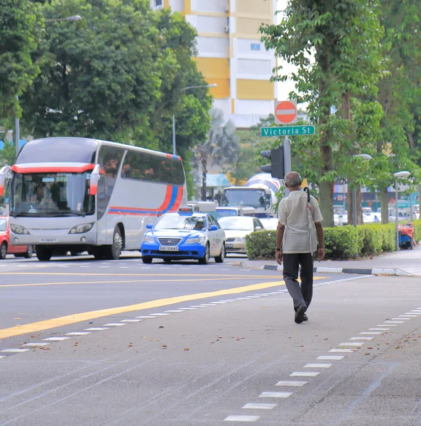 Old man with umbrella Singapore — Stock Photo, Image