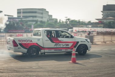 Pick-up car perform drifting on the track with motion blur