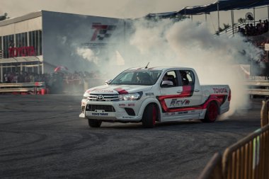 Pick-up car perform drifting with smoke