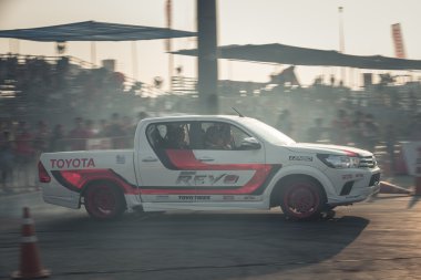 Pick-up car perform drifting on the track with motion blur