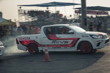 Pick-up car perform drifting on the track with motion blur