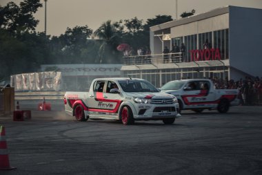Pick-up car perform drifting on the track with motion blur
