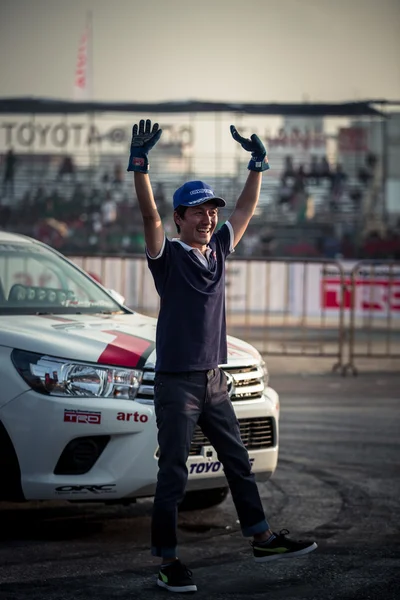 Japanese driver waving hand after show