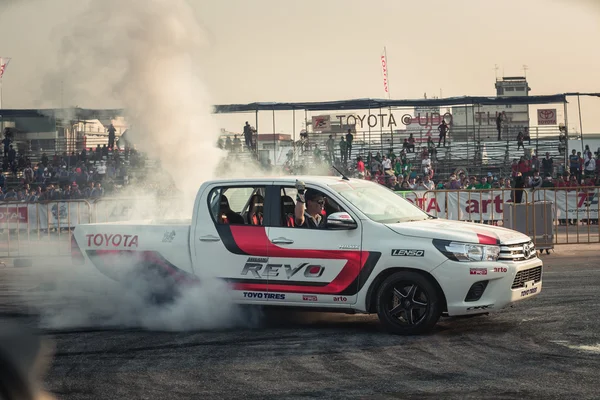 Pick-up car perform burnout tire on the track