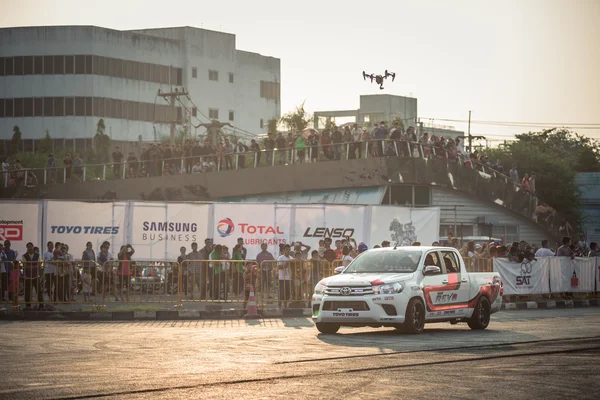 broadcasting drone above the car