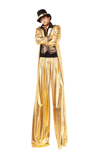 Boy in gold on stilts