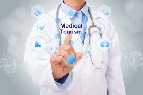 Doctor with medical tourism sign — Stock Photo, Image