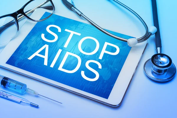 Detener palabras SIDA en la pantalla de la tableta — Foto de Stock