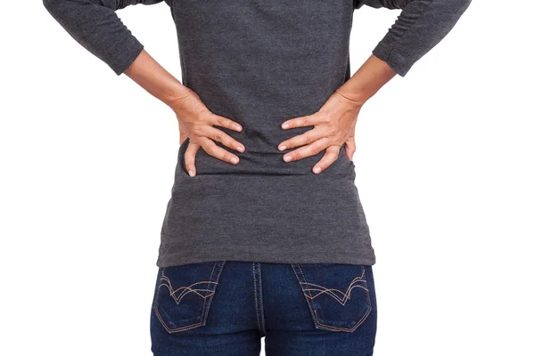 Young woman with back pain on white background — Stock Photo, Image