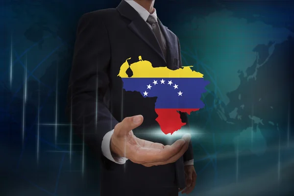 Бизнесмен, показывающий карту Венесуэлы — стоковое фото