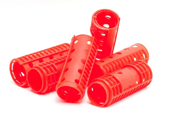 A stack of red hair rollers — Stock Photo, Image