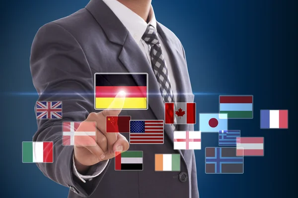 Businessman choosing German Flag — Stock Photo, Image