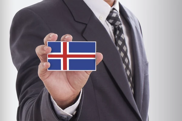 Zakenman houden IJsland vlag — Stockfoto