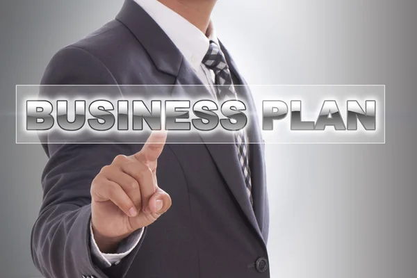 Businessman hand touching business plan word — Stock Photo, Image