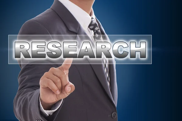 Businessman hand touching research — Stock Photo, Image