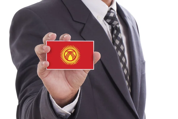 Businessman holding Kyrgyzstan Flag — Stock Photo, Image