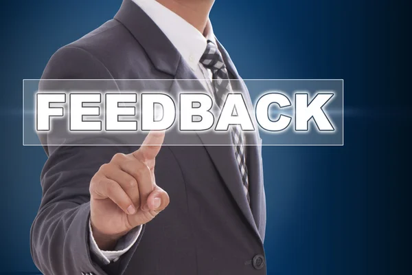 Businessman hand touching feedback on screen — Stock Photo, Image