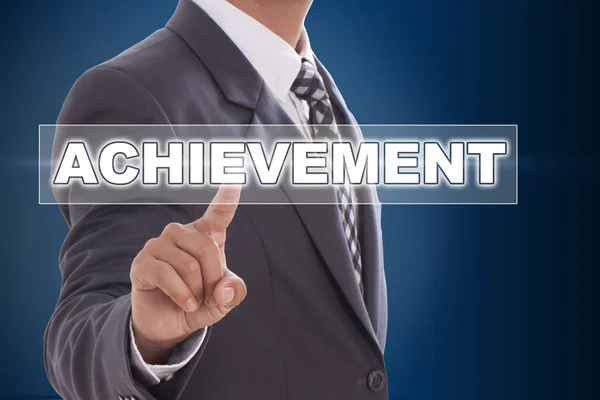 Businessman hand touching achievement — Stock Photo, Image