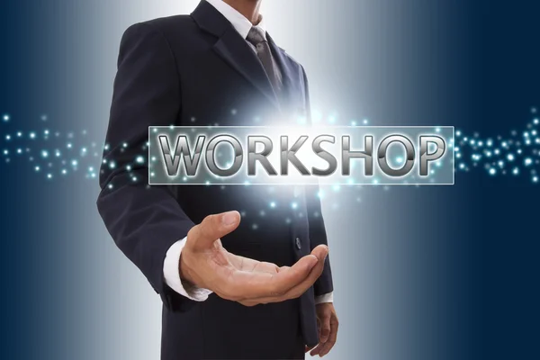 Businessman hand showing workshop . — Stock Photo, Image