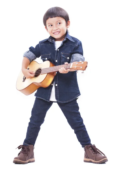 Söt pojke spela ukulele — Stockfoto