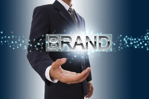 Businessman hand showing brand. — Stock Photo, Image