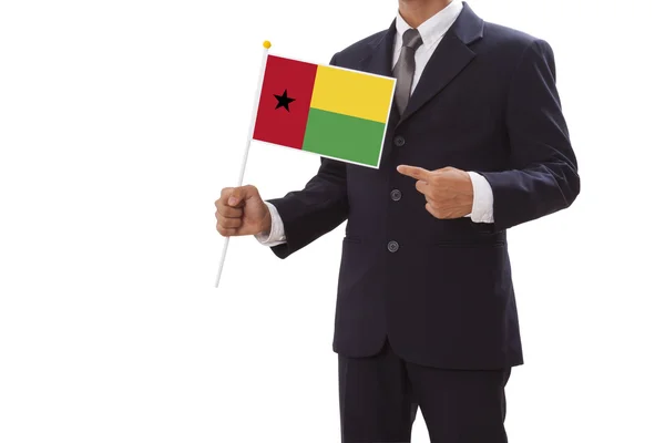 Empresário de terno segurando a Bandeira da Guiné Bissau — Fotografia de Stock