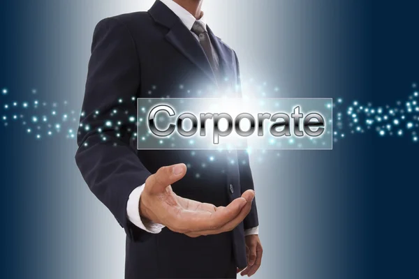 Businessman with corporate word. — Stock Photo, Image