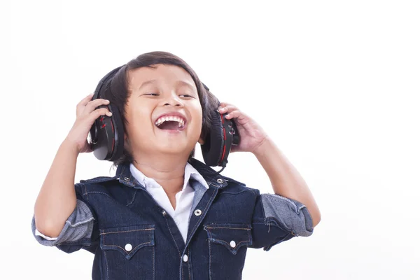 Menino feliz com fones de ouvido — Fotografia de Stock