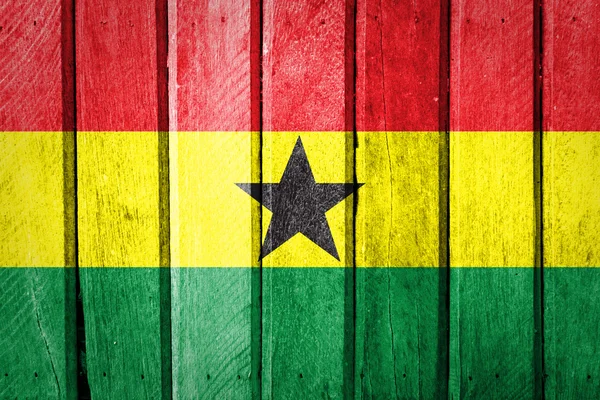 Ghana Bandera sobre fondo de madera vieja — Foto de Stock