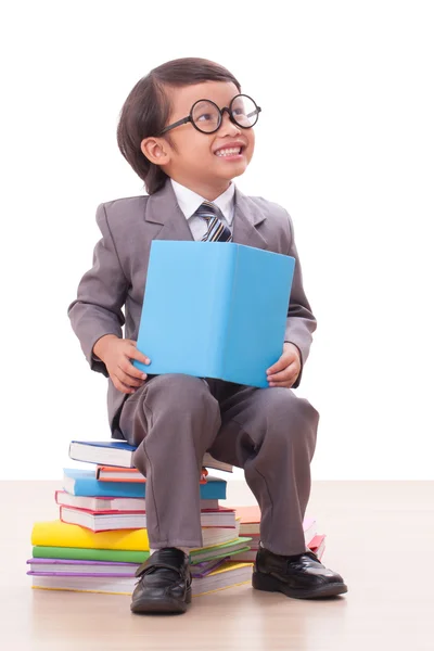 Ute boy in suit reading a book — Stock Photo, Image