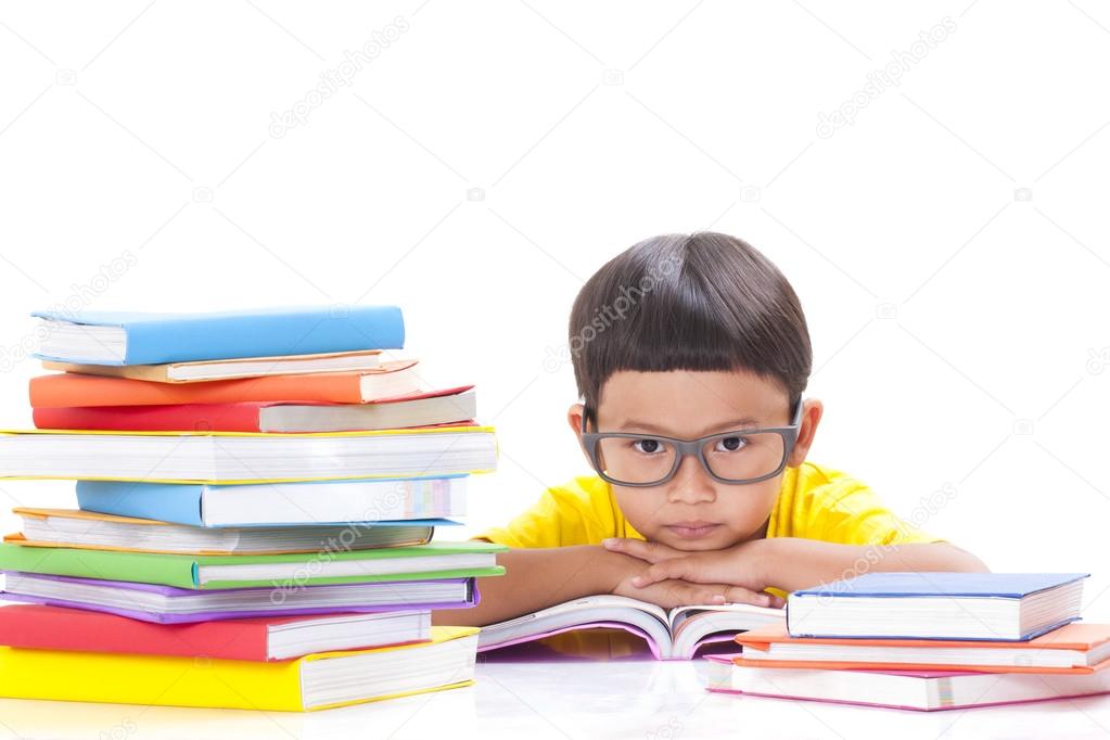 cute little boy is reading a book