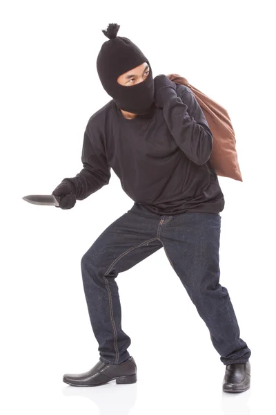 Thief with bag and holding knife, — Stock Photo, Image