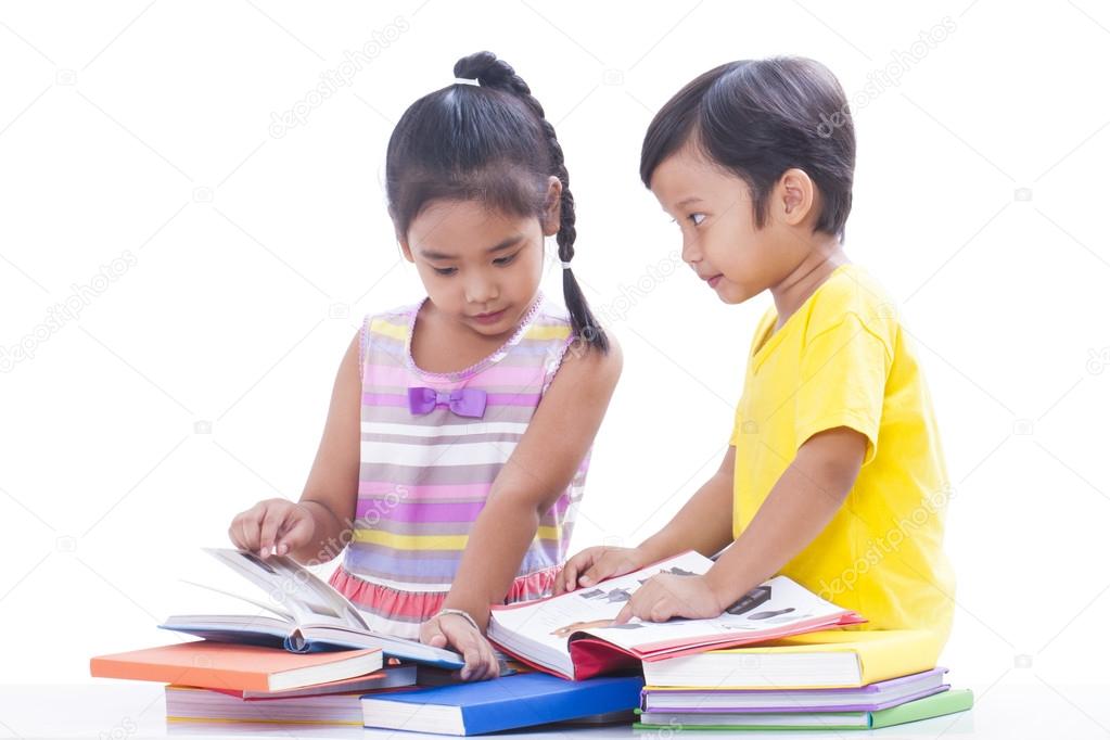 Little boy and girl reading books