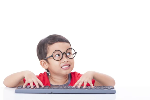 Cute Boy using a keyboard — Stock Photo, Image
