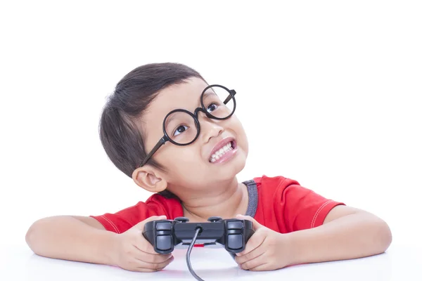 Boy playing video game with glasses — Stock Photo, Image